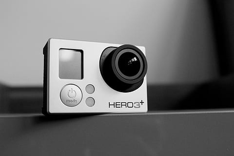 white gopro hero3+, gopro, camera, video, technology, gadget, equipment, movie, media, electronic, action, action camera, device, digital, tech, communication, photography themes, indoors, camera - photographic equipment, lens - optical instrument, close-up, text, single object, no people, arts culture and entertainment, photographic equipment, western script, digital camera, wall - building feature, shape, electronics industry, connection, black color, push button, home video camera, slr camera, 5K, CC0, public domain, royalty free
