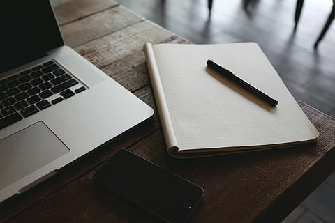 macbook, pro, brown, table, black, ball, pen, top, white, book, laptop, computer, notepad, graph paper, technology, business, no people, wireless technology, indoors, close-up, day, connection, high angle view, wood - material, communication, still life, furniture, desk, writing instrument, paper, portable information device, publication, office, note pad, blank, 5K