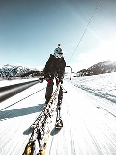 slopes, man snow skiing, downhill, slope, daytime, person, skiing, skiier, snow, track, winter, cold temperature, sport, real people, sky, winter sport, leisure activity, mountain, warm clothing, lifestyles, one person, nature, day, full length, transportation, mountain range, beauty in nature, outdoors, snowcapped mountain, ski-wear, 4K, CC0, public domain, royalty free