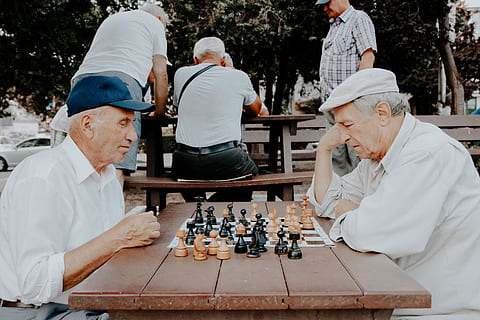 two, men, playing, chess, grandfather, table, man, male, old, elderly, park, game, board game, leisure games, leisure activity, chess board, senior adult, strategy, chess piece, senior men, males, real people, lifestyles, people, sitting, day, adult, 5K, CC0, public domain, royalty free