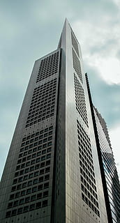 grey concrete building, architecture, building, infrastructure, structure, establishment, office, work, clouds, sky, windows, condominium, hotel, modern, skyscraper, building exterior, city, tower, built structure, low angle view, city life, office building exterior, tall - high, cloud - sky, no people, nature, day, glass - material, outdoors, 4K