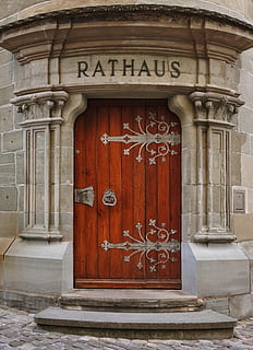 door, architecture, facade, input, pillar, travel, town hall, building, germany, überlingen, rustic, wood, brown, stone, tower, historically, monument, portal, ornaments, antique, handle, entrance, building exterior, built structure, closed, day, communication, safety, no people, text, security, protection, wood - material, city, outdoors, arch, western script, ornate, 5K, CC0, public domain, royalty free