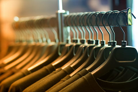 clothes, hangers, rack, in a row, coathanger, hanging, shopping, indoors, retail, large group of objects, store, no people, order, repetition, business, fashion, clothes rack, choice, variation, arrangement, side by side, clothing, consumerism, coat hook, 5K