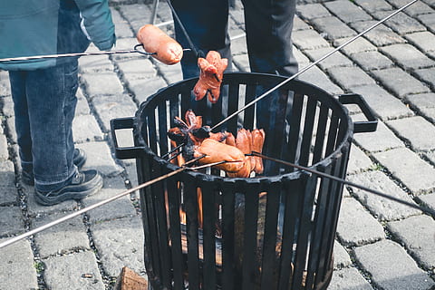 roasting sausages outside, sausages, outside, meat, sausage, food, barbecue Grill, barbecue, cooking, grilled, outdoors, fire - Natural Phenomenon, heat - Temperature, meal, food And Drink, flame, coal, preparation, high angle view, real people, day, freshness, preparing food, men, people, metal, burning, fire, lifestyles, 4K, CC0, public domain, royalty free