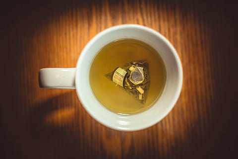 white, ceramic, mug, filled, tea, bag, cup, drinks, drink, food and drink, refreshment, tea cup, tea - hot drink, directly above, table, no people, indoors, herbal tea, hot drink, wood - material, teabag, food, freshness, wellbeing, close-up, crockery, afternoon tea, non-alcoholic beverage, 5K, CC0, public domain, royalty free