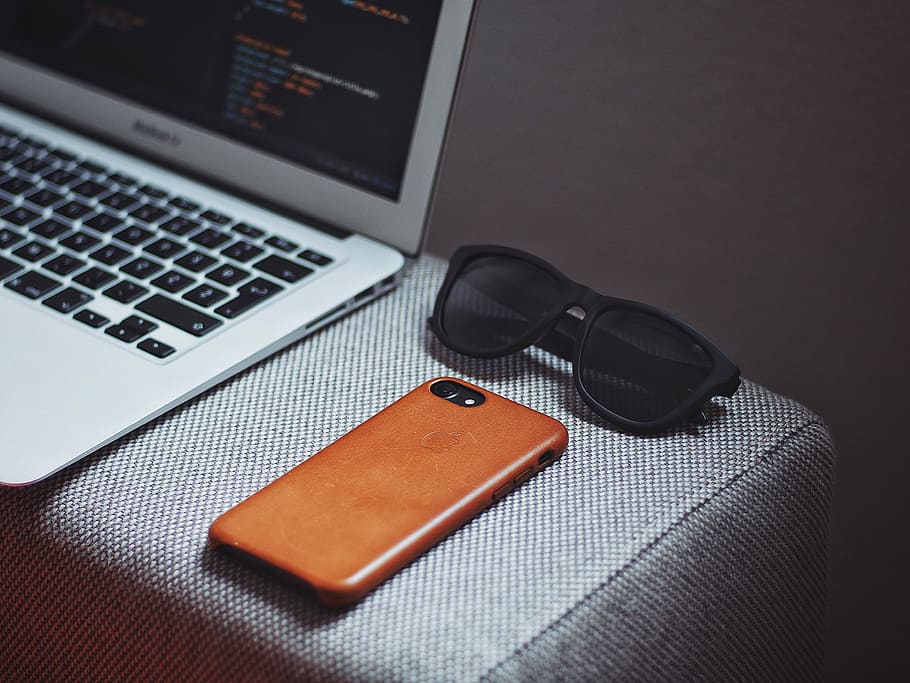 orange, smartphone, black, framed, sunglasses, beside, macbook air, iphone, macbook, keyboard, computer, laptop, glasses, phone, phone case, sofa, chair, sunglass, minimal, edc, essential, leather, case, technology, wireless technology, connection, communication, table, portable information device, computer equipment, indoors, furniture, still life, no people, computer keyboard, business, close-up, high angle view, listening, smart phone, 4K