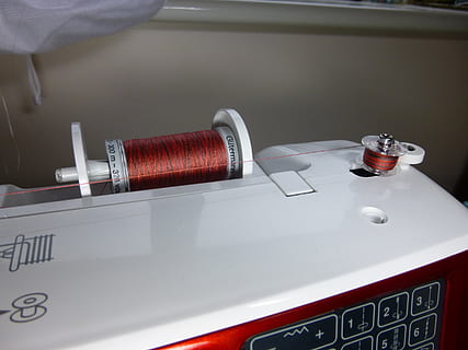 sewing, sewing machine, thread, bobbin, sew, stitch, equipment, indoors, healthcare and medicine, red, close-up, no people, metal, household equipment, table, container, business, still life, file, office, paper, document, office supply, machinery, high angle view, technology, steel, airtight, silver colored, care, 2K, CC0, public domain, royalty free
