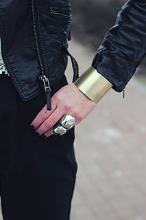 person, black, leather jacket, wide, bangle, bracelet, cuff, jewellery, jewelry, hand, hands, ring, rings, leather, jacket, human hand, human body part, real people, social issues, midsection, holding, crime, focus on foreground, two people, standing, adult, people, men, clothing, handcuffs, day, lifestyles, outdoors, body part, finger, 5K, CC0, public domain, royalty free