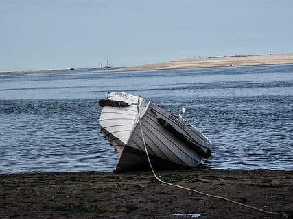 white, dinghy boat, sand, body, water, brown, boat, day, time, transportation, rope, shore, coast, sky, clouds, horizon, sea, ocean, beach, nautical vessel, moored, tranquility, no people, mode of transportation, land, nature, scenics - nature, tranquil scene, beauty in nature, outdoors, non-urban scene, clear sky, sailboat, rowboat, fishing boat, anchored, 5K