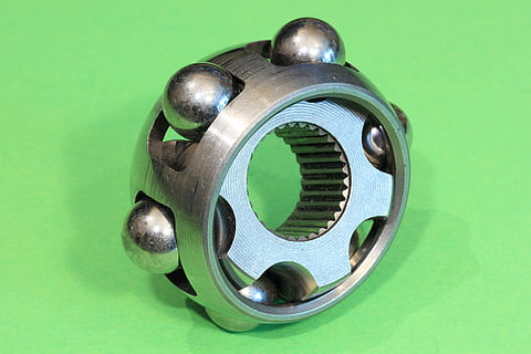 constant, velocity, joint, coupling, automotive, car, drivetrain, race, cage, ball, cv, driveshaft, homokinetic, green background, green color, colored background, studio shot, indoors, no people, metal, close-up, single object, still life, circle, shape, silver colored, cut out, geometric shape, security, selective focus, design, machinery, blue background, 4K, CC0, public domain, royalty free