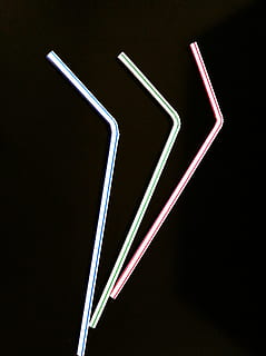 three assorted-color straws, Drinking Straw, Beverage, straw, drinking, liquid, refreshment, plastic, soda, fun, restaurant, cafe, party, accessories, cafeteria, tube, suck, sip, black background, black color, no people, studio shot, close-up, indoors, illuminated, creativity, cut out, lighting equipment, pattern, still life, art and craft, white color, long exposure, light - natural phenomenon, simplicity, neon, abstract, night, 2K, CC0, public domain, royalty free