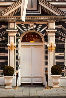door, hotel, input, hell, doors, architecture, built structure, entrance, building exterior, building, no people, text, closed, communication, sign, plant, day, potted plant, city, footpath, residential district, outdoors, illuminated, facade, ornate, flower pot, tiled floor, 1080P, CC0, public domain, royalty free