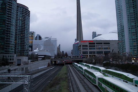 white, green, train, train railroad, subway, trains, high, rise, buildings, photo, architecture, infrastructure, sky, cloud, city, tower, skyline, skyscraper, urban, bridge, transportation, travel, track, railway, building exterior, city life, cityscape, street, built structure, cloud - sky, urban skyline, building, office building exterior, mode of transportation, tall - high, nature, modern, office, road, no people, residential district, outdoors, financial district, 5K, CC0, public domain, royalty free