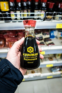 kikkoman soy sauce, Kikkoman, soy sauce, retail, store, editorial, bottle, consumerism, brand-name, human hand, human body part, one person, drink, container, hand, refreshment, food and drink, real people, focus on foreground, indoors, holding, alcohol, food, glass - material, transparent, freshness, lifestyles, finger, glass, 5K