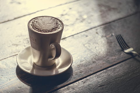 Coffee with milk, cafe, caffe, caffe creme, caffe latte, caffelatte, cappuccino, coffee, cortado, cup, espresso, fork, latte, lungo, milk, table, white, coffee - Drink, drink, wood - Material, coffee Cup, caffeine, brown, food and drink, no people, high angle view, indoors, close-up, still life, eating utensil, saucer, kitchen utensil, crockery, sunlight, focus on foreground, mug, shadow, silver colored, 5K