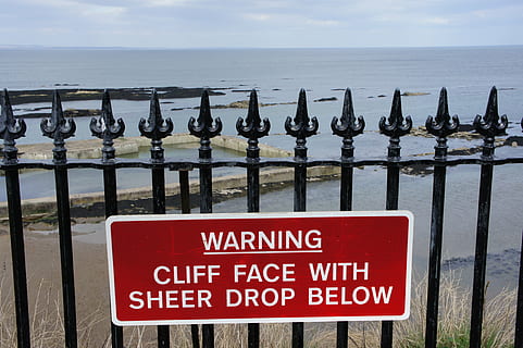 warning, danger, cliff, sign, caution, dangerous, risk, hazard, attention, accident, hazardous, protection, warn, text, information, beware, forbidden, beach, coast, cliff face, drop, sea, water, sky, horizon, horizon over water, western script, communication, nature, railing, scenics - nature, day, no people, beauty in nature, tranquility, red, barrier, message, 4K, CC0, public domain, royalty free
