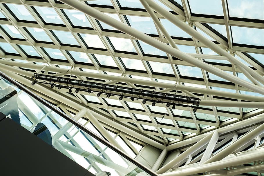 angle, architecture, building exterior, construction, contemporary, design, expression, futuristic, geometric, industry, modern, perspective, reflection, steel, urban, low angle view, built structure, pattern, no people, ceiling, indoors, metal, day, building, architectural feature, glass - material, window, roof, repetition, sunlight, skylight, office building exterior, roof beam, architecture and art, silver colored, 4K