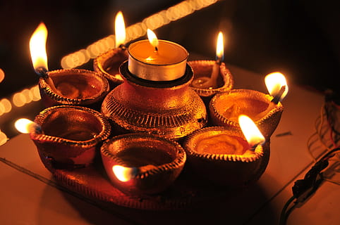 lit candles, festive, indian, devotion, burning, fire, flame, illuminated, fire - natural phenomenon, glowing, oil lamp, heat - temperature, candle, no people, lighting equipment, close-up, diya - oil lamp, celebration, diwali, nature, indoors, decoration, traditional festival, electric lamp, tea light, 4K, CC0, public domain, royalty free