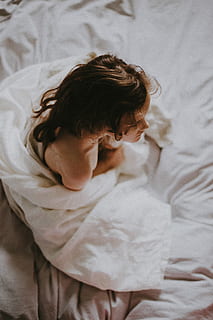 child at bedtime, woman, wearing, white, dress, child, bed, sheets, girl, furniture, one person, indoors, real people, relaxation, childhood, high angle view, lifestyles, lying down, bedroom, domestic room, textile, sleeping, blanket, resting, white color, sheet, innocence, 4K, CC0, public domain, royalty free