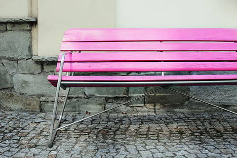 wide, angle shot, vibrantly, coloured, pink, bench, urban, setting, image, captured, canon dslr, Wide angle, shot, Canon, DSLR, outdoors, chair, seat, no People, pink color, built structure, close-up, day, indoors, wall - building feature, cobblestone, absence, empty, footpath, wall, architecture, street, sidewalk, relaxation, flooring, furniture, paving stone, tiled floor, park bench, purple, 5K