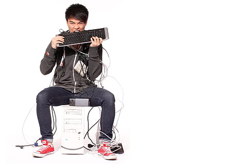 man, black, hoodie, biting, keyboard, pc, computer, internet, networking, online, technology, support, connection, programming, repairs, under construction, studio shot, white background, one person, musical instrument, cut out, full length, music, young adult, guitar, indoors, string instrument, arts culture and entertainment, musical equipment, sitting, casual clothing, holding, playing, musician, men, front view, plucking an instrument, rock music, skill, electric guitar, 4K