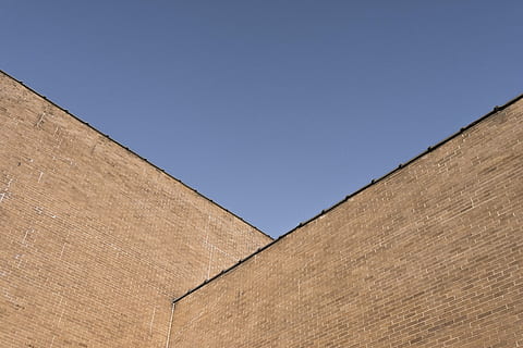 brown concrete building, brown, concrete, building, urban, lazy, blue, sky, buildings, city, minimal, shapes, geometric, iowa, architecture, building Exterior, brick, wall - Building Feature, architecture And Buildings, built Structure, sunny, clear sky, day, outdoors, no people, copy space, nature, sunlight, low angle view, wall, shape, landscape, 5K, CC0, public domain, royalty free