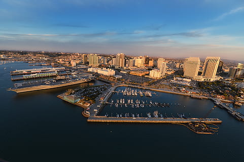 skyline photography, city high-buildings, cityscape, photo, city, blue, clouds, sky, skyline, architecture, building, infrastructure, tower, bridge, pathway, yacht, boat, ship, sea, ocean, water, aerial, view, no people, cloud - sky, outdoors, travel destinations, urban skyline, illuminated, building exterior, built structure, transportation, nautical vessel, office building exterior, nature, high angle view, skyscraper, mode of transportation, modern, 4K