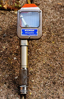 compression pressure recorder, compression tester, device, tool, auto, text, communication, western script, day, no people, land, nature, field, focus on foreground, sign, technology, information, outdoors, close-up, metal, information sign, guidance, pole, high angle view, road, 5K, CC0, public domain, royalty free