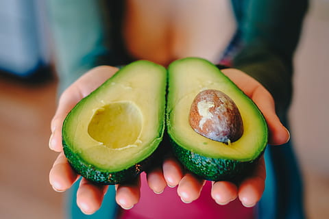 halves of avocado, Halves, avocado, food/Drink, diet, food, fruit, healthy, salad, vegetables, cucumber, vegetable, freshness, people, slice, healthy Eating, women, human Hand, close-up, part Of, holding, females, human body part, food and drink, one person, hand, focus on foreground, wellbeing, indoors, midsection, body part, real people, showing, lifestyles, finger, 4K
