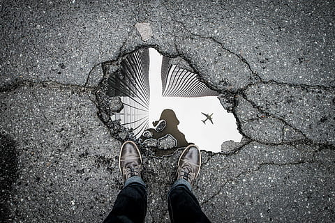 person, standing, front, body, water, black, jeans, puddle, road, cracks, pothole, low section, human leg, shoe, personal perspective, human body part, body part, real people, one person, street, city, high angle view, directly above, lifestyles, nature, day, footpath, unrecognizable person, leisure activity, outdoors, human limb, human foot, 4K, CC0, public domain, royalty free
