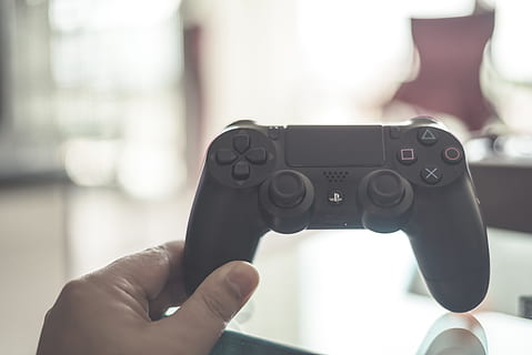 person, holding, black, playstation dualshock 4, controller, playstation, hand, game, console, video, joystick, entertainment, gamepad, leisure, gaming, fun, toy, white, button, station, videogame, equipment, peripheral, wireless, electronic, keypad, activity, remote, human hand, human body part, one person, focus on foreground, close-up, technology, indoors, body part, personal perspective, communication, day, adult, human finger, finger, connection, wireless technology, 5K, CC0, public domain, royalty free