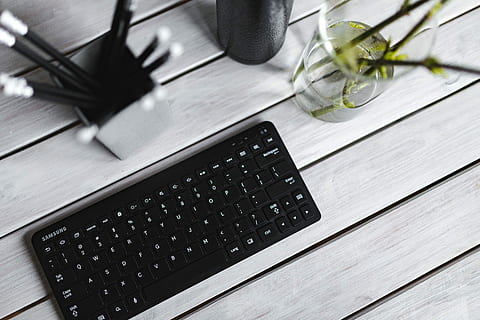 black, keyboard, pencils, white, table, bottle, plant, computer, technology, laptop, desk, business, computer Keyboard, office, wood - Material, pC, equipment, no People, internet, wireless technology, high angle view, communication, indoors, connection, computer equipment, nature, leaf, close-up, food and drink, 5K