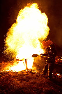 fire, firefighter, sparks, burning, flame, fire - natural phenomenon, heat - temperature, real people, night, glowing, men, warning sign, motion, nature, sign, communication, occupation, people, risk, full length, standing, skill, bonfire, 2K, CC0, public domain, royalty free