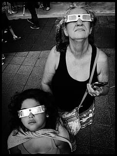 eclipse, solar eclipse, glasses, expression, looking up, sky, pov, symmetry, mother, daughter, grandma, black and white, real people, females, lifestyles, women, portrait, adult, leisure activity, sunglasses, two people, front view, child, togetherness, family, looking at camera, people, fashion, casual clothing, males, 4K, CC0, public domain, royalty free