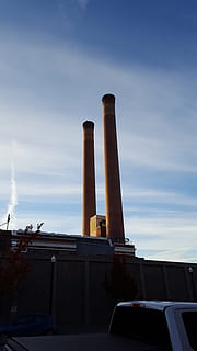 smoke, stack, city, building, building exterior, built structure, sky, factory, architecture, industry, smoke stack, cloud - sky, low angle view, no people, nature, pollution, day, outdoors, chimney, environmental issues, tall - high, motor vehicle, air pollution, metal, 2K, CC0, public domain, royalty free
