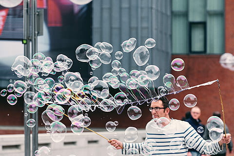 man, making, soap bubbles, daytime, playing, water bubbles, bubble, person, line, reflection, art, street, city, bokeh, vulnerability, fragility, architecture, bubble wand, one person, men, adult, soap sud, happiness, day, front view, portrait, smiling, young adult, built structure, mid-air, emotion, outdoors, lightweight, 5K, CC0, public domain, royalty free