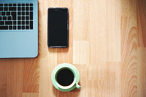 green, ceramic, mug, filled, coffee, saucer, beside, black, android smartphone, office, phone, table, laptop, from home, work, smartphone, computer, coffee mug, coffee cup, desktop, work from home, keyboard, workstation, office desks, portable, technology, wood - Material, desk, business, coffee - Drink, cup, smart Phone, mobile Phone, telephone, internet, equipment, wireless Technology, drink, food and drink, refreshment, communication, directly above, connection, portable information device, indoors, no people, crockery, 5K, CC0, public domain, royalty free