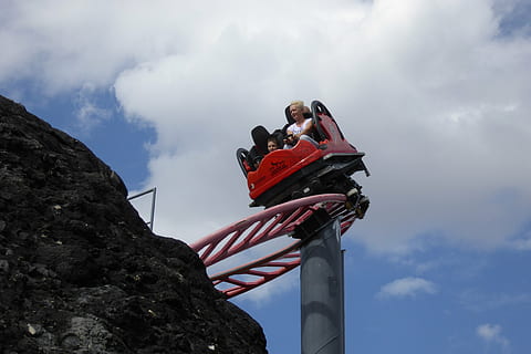 roller coaster, attraction, fun, emotion, risk, family, amusement park, people, have a good time, sky, speed, clouds, blue, mountain, low angle view, cloud - sky, nature, day, architecture, women, standing, men, outdoors, real people, adult, built structure, females, climbing, communication, leisure activity, two people, mid adult, 4K, CC0, public domain, royalty free