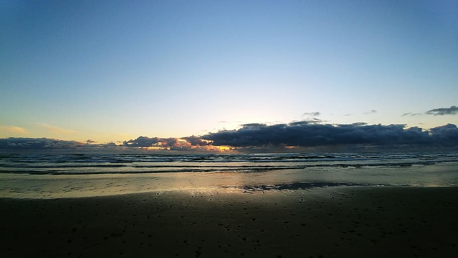 posta de sol, Platja d'Oregon, núvols, aigua, cel, mar, terra, platja, escenics - natura, tranquil·litat, naturalesa, bellesa a la natura, sorra, escena tranquil·la, medi ambient, cap gent, llum solar, reflexió, còpia espai, viatjar, blau, a l'aire lliure, 4K