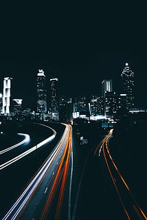 time-lapse, photography vehicle, road, distant, high, rise buildings, architecture, building, infrastructure, sky, skyscraper, tower, dark, night, skyline, city, urban, lights, transportation, travel, traffic, street, highway, cityscape, urban Scene, speed, car, downtown District, urban Skyline, multiple Lane Highway, blurred Motion, illuminated, built structure, building exterior, motion, long exposure, light trail, high angle view, the way forward, city life, no people, direction, office building exterior, outdoors, modern, 2K