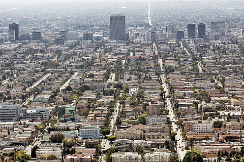 bird, eye view, city, aerial, view, architecture, buildings, infrastructure, tower, skyline, urban, tree, plant, road, street, cityscape, built structure, building exterior, no people, outdoors, day, sky, building, residential district, crowded, crowd, aerial view, high angle view, skyscraper, office building exterior, nature, landscape, travel destinations, urban sprawl, 2K