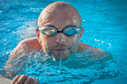 man, goggles, swimming, pool, float, water, swim, swimming pool, headshot, portrait, one person, leisure activity, lifestyles, front view, men, looking at camera, males, nature, adult, shirtless, enjoyment, eyewear, outdoors, 2K, CC0, public domain, royalty free