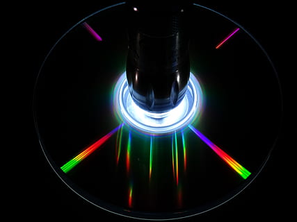 cd, dvd, digital, computer, silver, floppy disk, black background, multi colored, illuminated, glowing, indoors, fuel and power generation, heat - temperature, technology, studio shot, household equipment, lighting equipment, burner - stove top, close-up, no people, stove, shape, abstract, blue, light - natural phenomenon, communication, electricity, dark, 2K, CC0, public domain, royalty free