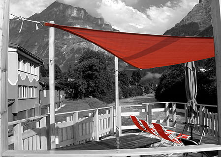 sun deck, eiger, eiger north face, hostel, grindelwald, architecture, flag, no people, day, tree, nature, red, built structure, mountain, sky, plant, outdoors, patriotism, barricade, transportation, road, building exterior, barrier, 2K, CC0, public domain, royalty free
