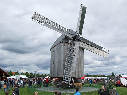 windmill, mill, building, pinwheel, wing, flour mill, wind, autumn, human, renewable energy, alternative energy, cloud - sky, wind turbine, sky, wind power, turbine, environmental conservation, environment, fuel and power generation, nature, traditional windmill, architecture, built structure, field, incidental people, land, day, group of people, building exterior, outdoors, 2K, CC0, public domain, royalty free