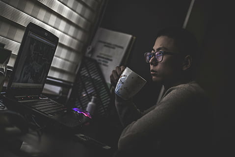 computer, cup, drinking, laptop, man, mug, person, eyeglasses, glasses, men, technology, one person, indoors, night, sitting, males, adult, music, activity, occupation, reading, concentration, lifestyles, young men, young adult, dark, 5K, CC0, public domain, royalty free