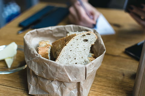 freshly, baked, bread, butter starter, butter, starter, close up, hands, wood, food, table, indoors, breakfast, freshness, meal, healthy Eating, slice, food and drink, close-up, focus on foreground, ready-to-eat, human hand, wood - material, wellbeing, one person, hand, human body part, serving size, holding, dairy product, high angle view, snack, 5K