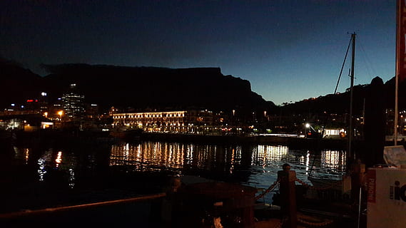 night, harbor, table, mountain, water, illuminated, architecture, sky, reflection, building exterior, built structure, city, nautical vessel, nature, no people, transportation, river, building, dusk, mode of transportation, outdoors, waterfront, light, sailboat, marina, 2K, CC0, public domain, royalty free