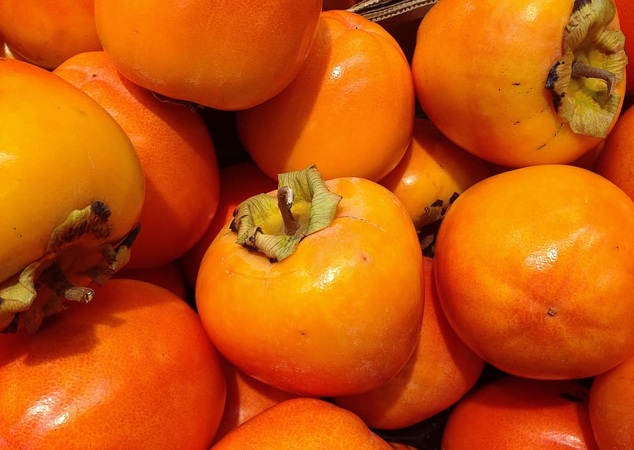 bunch, orange, fruits, fruit, persimmons, fall, food, food and drink, healthy eating, freshness, wellbeing, orange color, no people, large group of objects, full frame, backgrounds, market, close-up, still life, vegetable, abundance, high angle view, day, for sale, market stall, ripe, vegetarian food, 2K