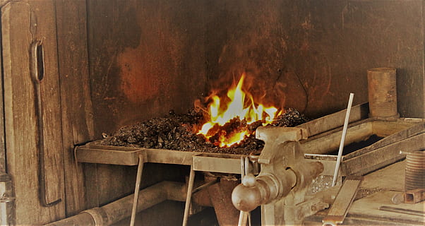 Metal, Iron Forge, forge, metal forge, blacksmith forge, blacksmith, workshop, metalwork, craftsman, shop, molten, hot, traditional, glowing, ironwork, flame, craftsmanship, handmade, iron, forging, craft, heat, hammer, smith, fire, skill, tools, anvil, handwork, manual, melting, industry, coal, ironworks, amber avalona, burning, heat - temperature, wood - material, no people, indoors, fire - natural phenomenon, wood, nature, firewood, fireplace, log, architecture, close-up, built structure, seat, motion, fire pit, 2K, CC0, public domain, royalty free
